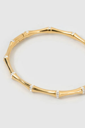 Electra Gold Cuff by Arms of Eve, sculptural gold cuff adorned with shimmering zircon stones for a bold, glamorous statement from day to night.