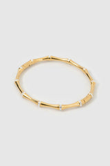 Electra Gold Cuff by Arms of Eve, sculptural gold cuff adorned with shimmering zircon stones for a bold, glamorous statement from day to night.