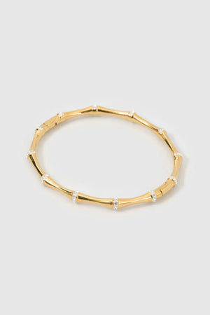 Electra Gold Cuff by Arms of Eve, sculptural gold cuff adorned with shimmering zircon stones for a bold, glamorous statement from day to night.