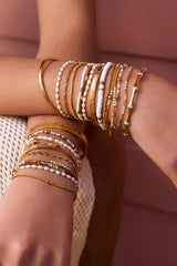 Electra Gold Cuff by Arms of Eve, sculptural gold cuff adorned with shimmering zircon stones for a bold, glamorous statement from day to night