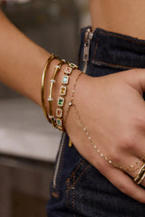 Electra Gold Cuff by Arms of Eve, sculptural gold cuff adorned with shimmering zircon stones for a bold, glamorous statement from day to night