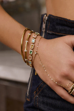 Electra Gold Cuff by Arms of Eve, sculptural gold cuff adorned with shimmering zircon stones for a bold, glamorous statement from day to night