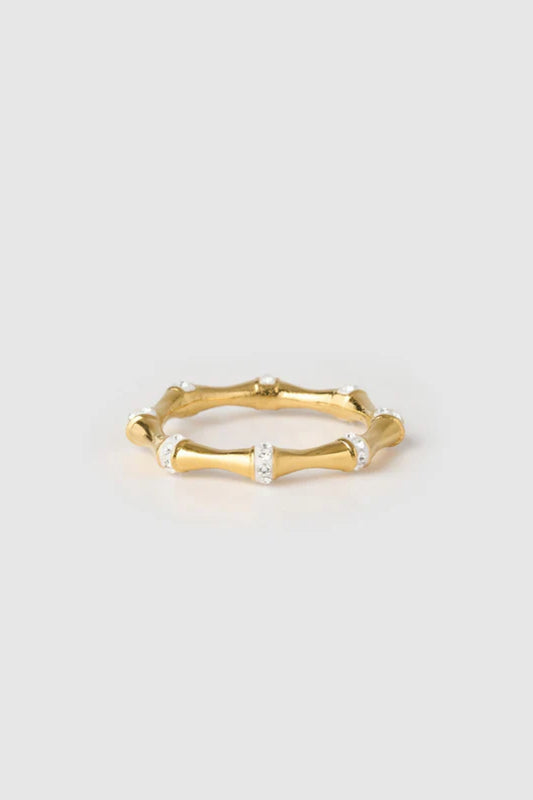 Electra Gold Ring by Arms of Eve, radiant gold band adorned with glistening zircon stones for a modern, stackable touch of everyday glamour.