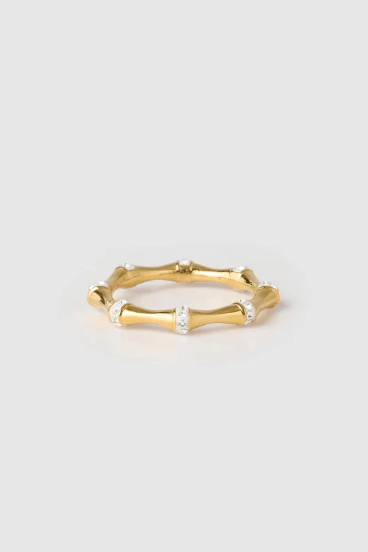 Electra Gold Ring by Arms of Eve, radiant gold band adorned with glistening zircon stones for a modern, stackable touch of everyday glamour.