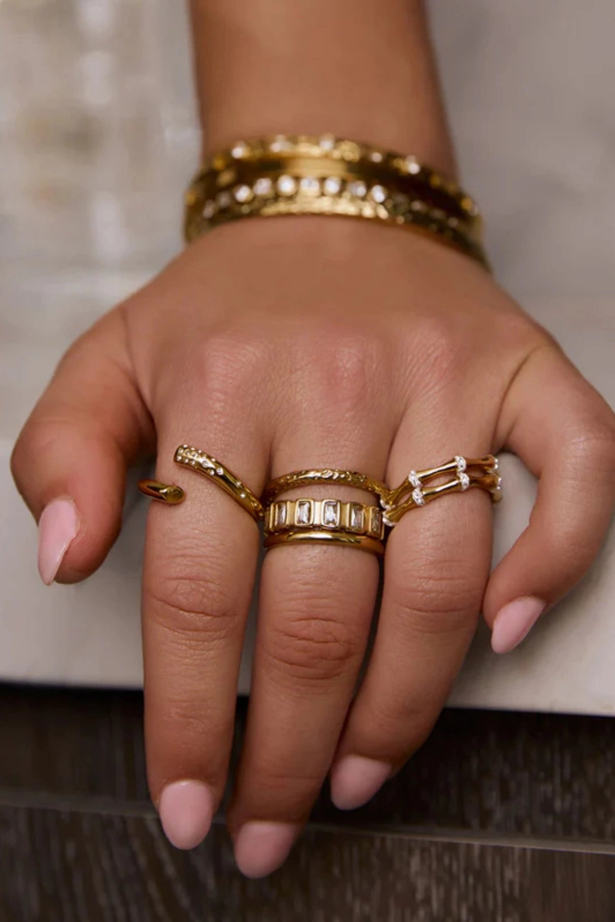 Electra Gold Ring by Arms of Eve, radiant gold band adorned with glistening zircon stones for a modern, stackable touch of everyday glamour