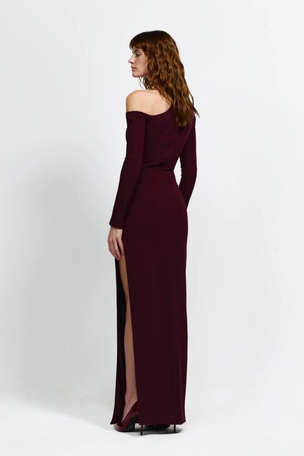 Cayley Gown by Eliya The Label, an off-shoulder stretch crepe gown with a side split and sculpted fit. Perfect for elegant formal events.