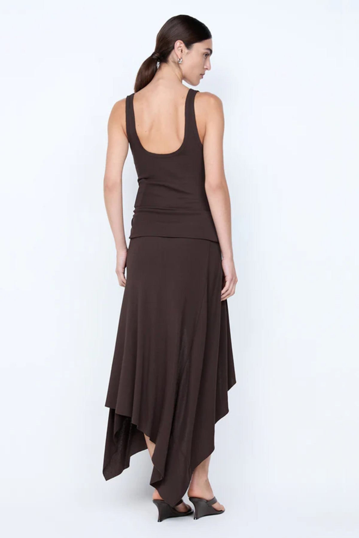Emerson Tank Dress by Bec + Bridge, a dark chocolate ribbed midi with square neckline and asymmetric hem. Ideal for chic daily wear.