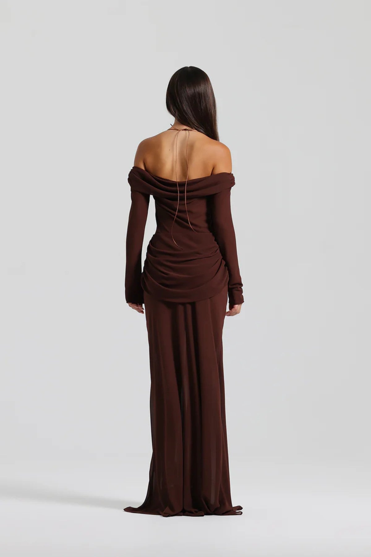 Emily Gown Espresso by Natalie Rolt, flowing off-shoulder gown with layered sheer fabric and halter tie, perfect for formal occasions.