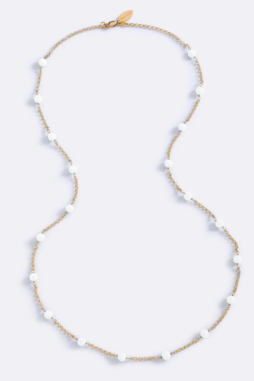 Endless Summer Beads White Glo by Emma Pills – gold plated long necklace with white enamel bead detailing.