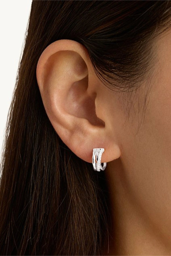 Entwined Hearts Earrings Sterling Silver by By Charlotte, triple-band crossover hoops with cubic zirconia accents.