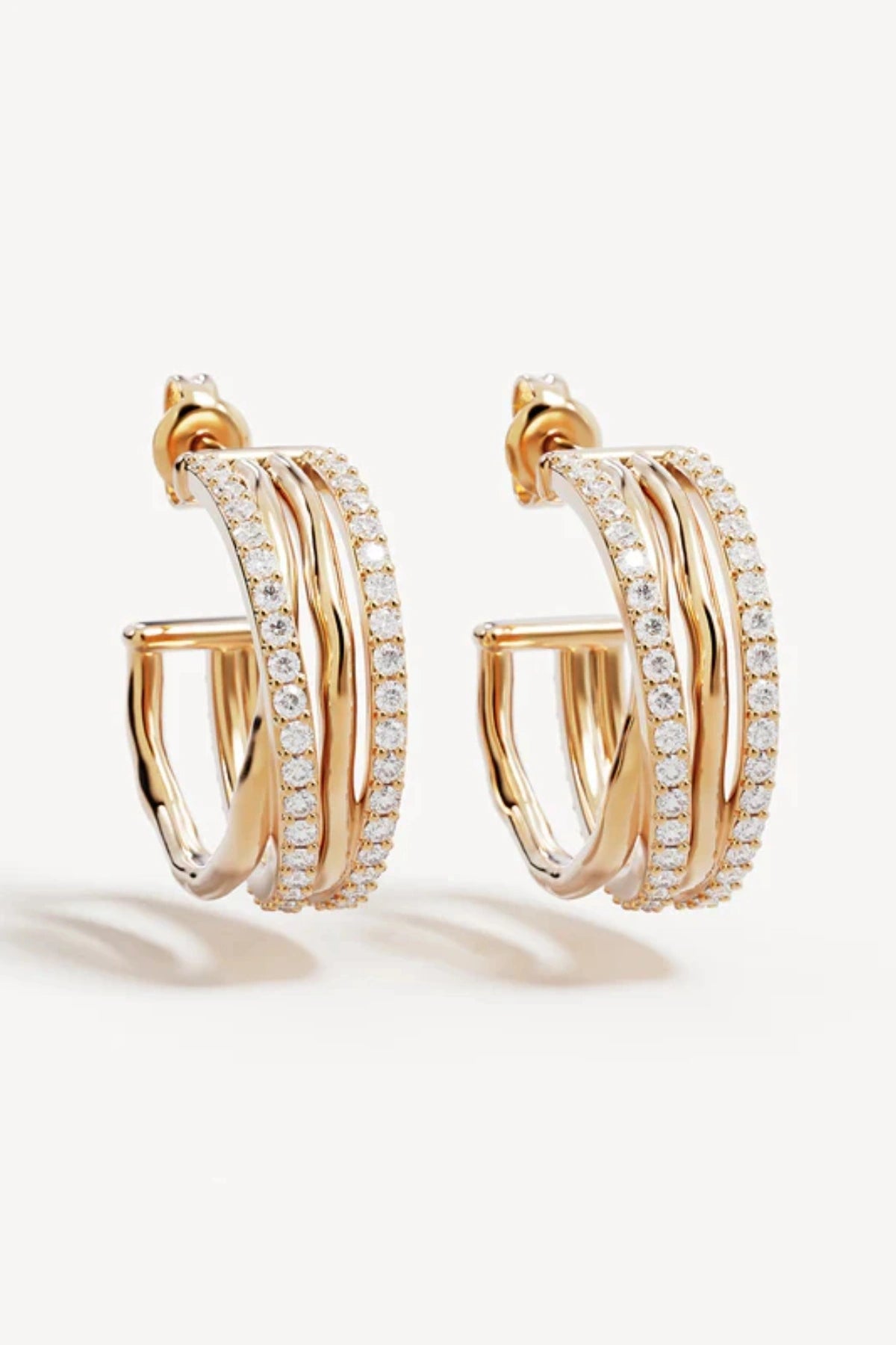 Entwined Hearts Large Hoops by By Charlotte — gold-plated intertwined crystal hoops symbolising connection and everyday elegance.