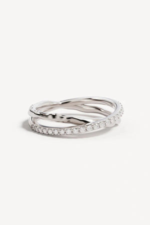 Entwined Hearts Ring by By Charlotte — a sterling silver double-band ring with intertwined crystal details, perfect for timeless everyday wear.