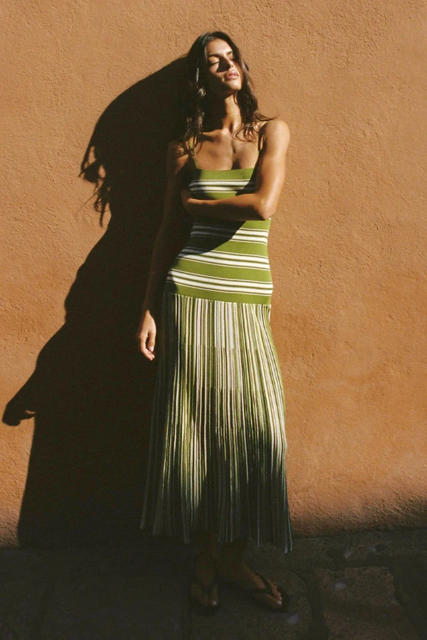 Esenia Knit Dress by Faithfull the Brand — an ombré striped knit maxi with a fitted bodice and relaxed skirt, perfect for warm-weather occasions.
