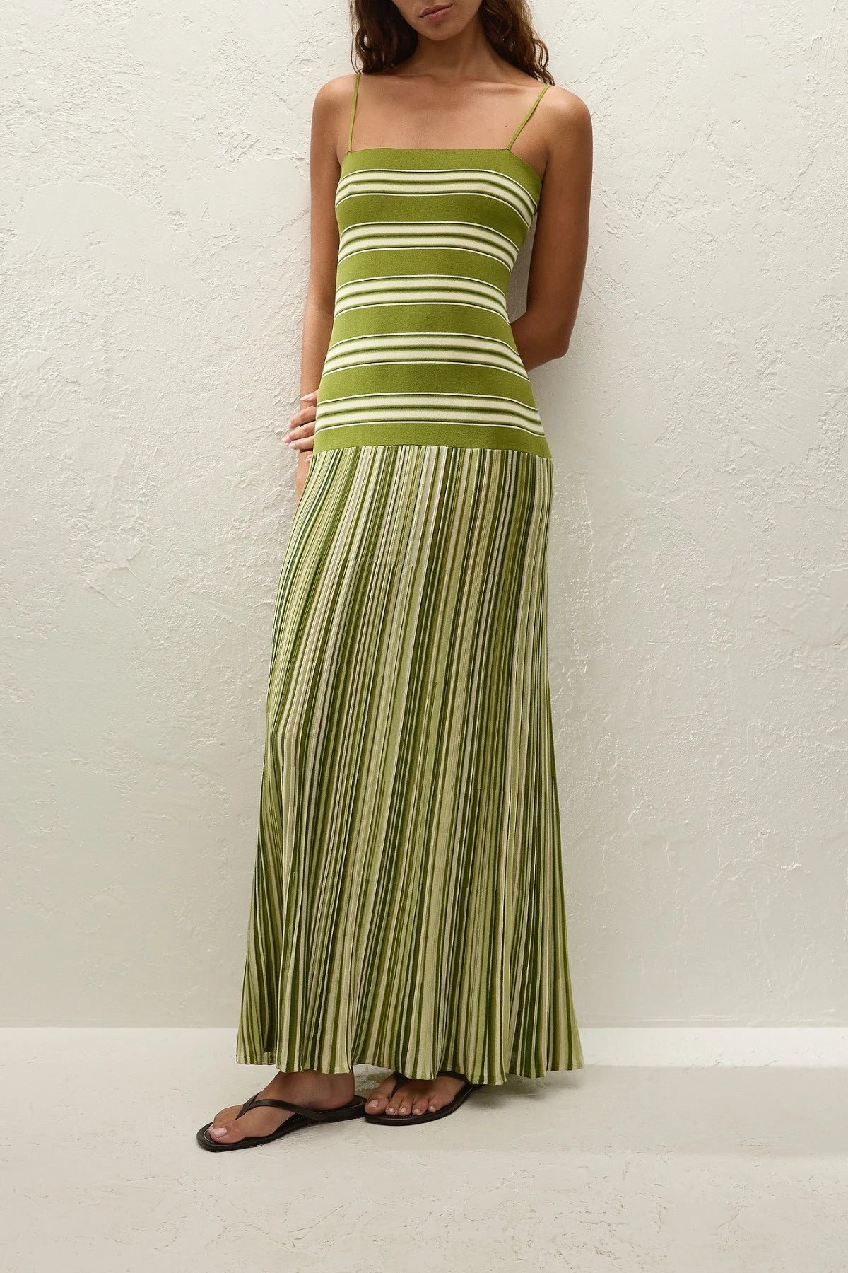 Esenia Knit Dress by Faithfull the Brand — an ombré striped knit maxi with a fitted bodice and relaxed skirt, perfect for warm-weather occasions.