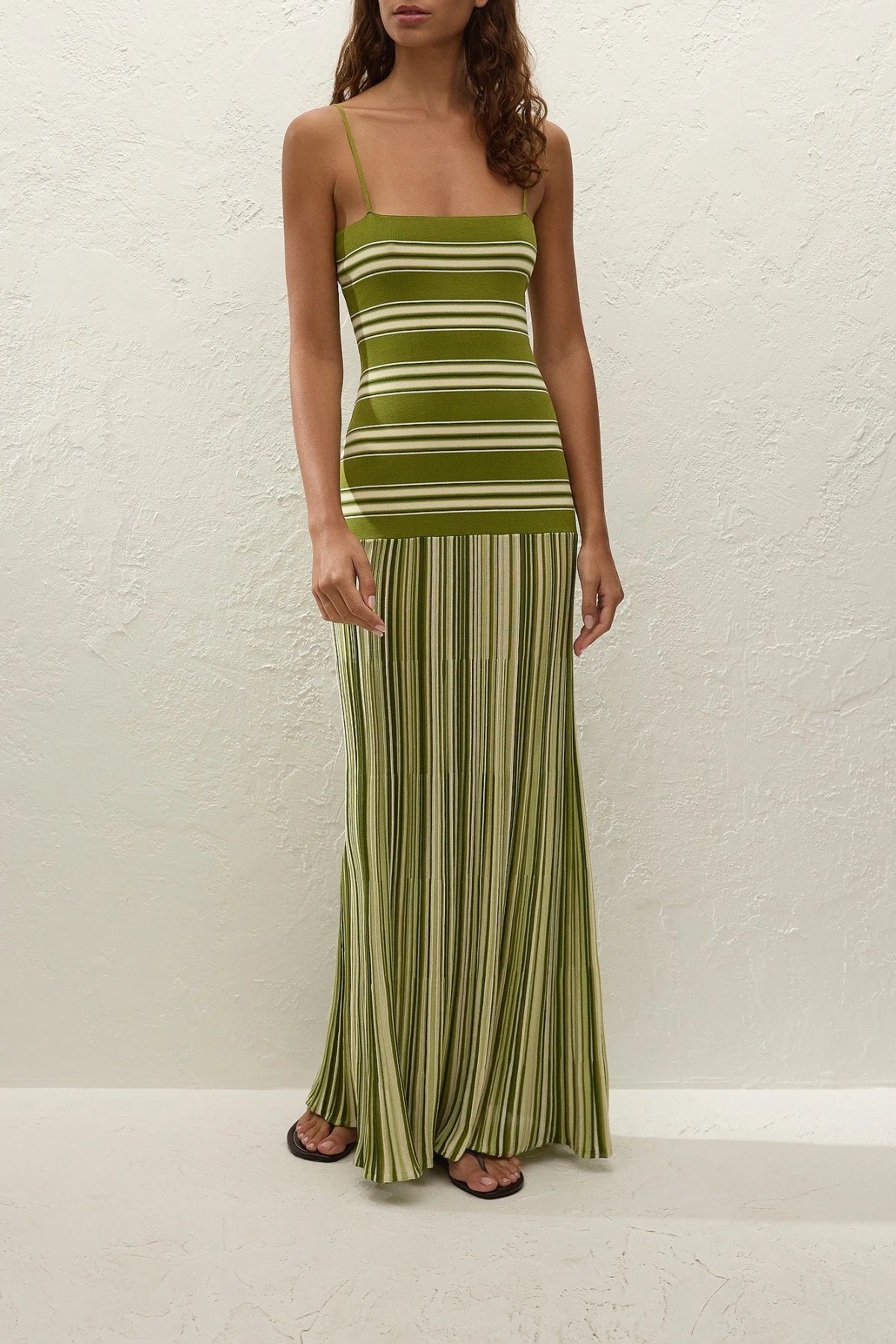 Esenia Knit Dress by Faithfull the Brand — an ombré striped knit maxi with a fitted bodice and relaxed skirt, perfect for warm-weather occasions.