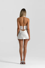 Evelyn Mini Skirt in White by Natalie Rolt, a bias-cut silk mini with soft waist draping. Perfect for pairing with corset tops.