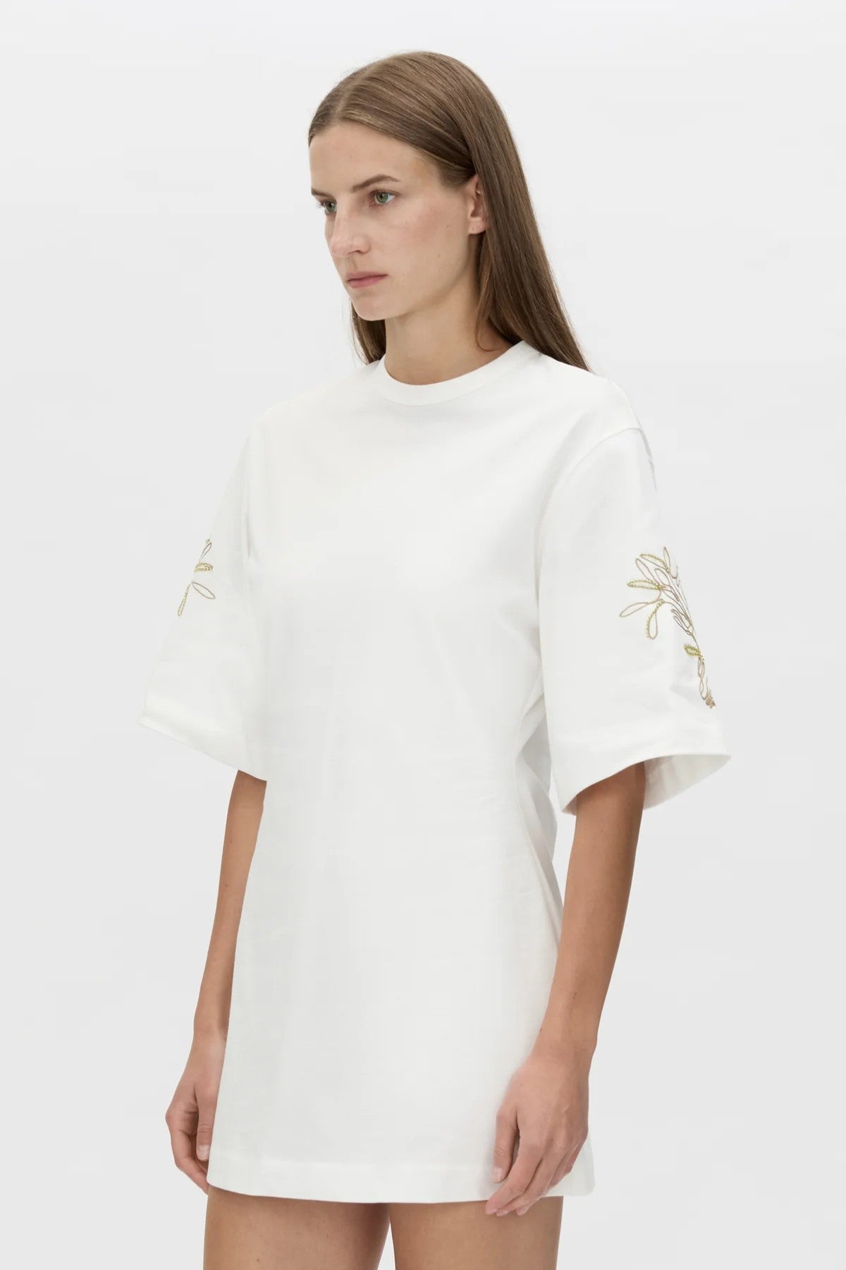 Eviva Mini Dress Soft White by Camilla and Marc, sculptural white mini with bold shoulders and intricate beaded detailing.
