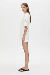 Eviva Mini Dress Soft White by Camilla and Marc, sculptural white mini with bold shoulders and intricate beaded detailing.