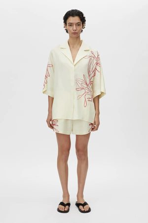 Eviva Shirt by Camilla and Marc – a lemon short-sleeve shirt with beaded embroidery and clean lines, perfect for bright polished days.