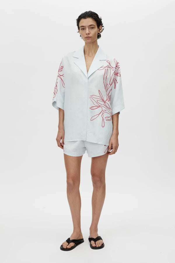 Eviva Shirt in Ice Blue by Camilla and Marc – a clshort-sleeve shirt with beaded embroidery and clean lines, perfect for bright polished days.