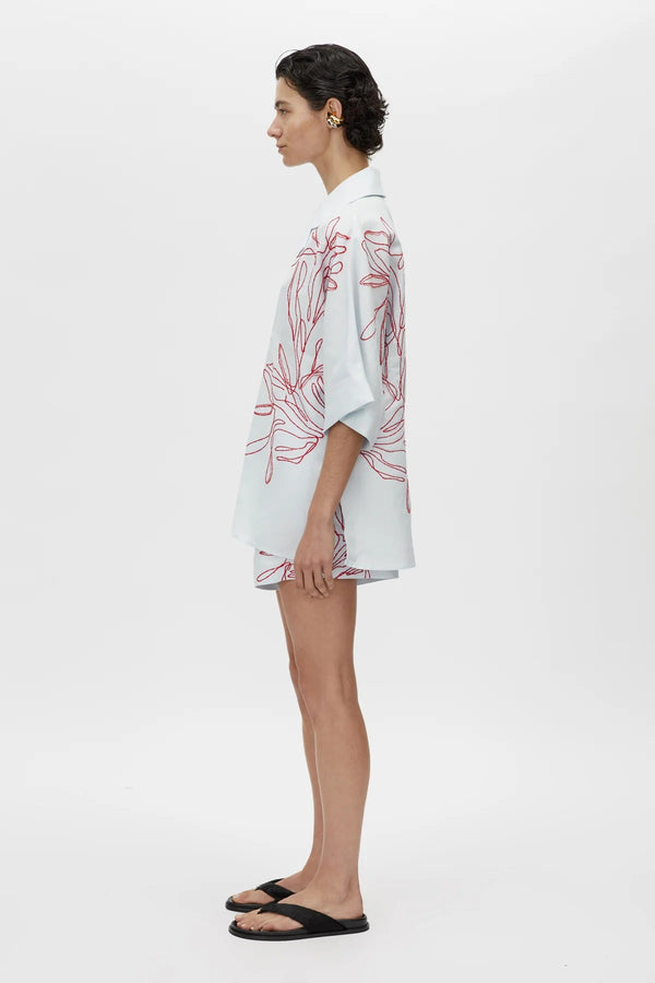 Eviva Shirt in Ice Blue by Camilla and Marc – a clshort-sleeve shirt with beaded embroidery and clean lines, perfect for bright polished days.