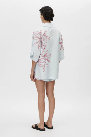 Eviva Shirt in Ice Blue by Camilla and Marc – a clshort-sleeve shirt with beaded embroidery and clean lines, perfect for bright polished days.