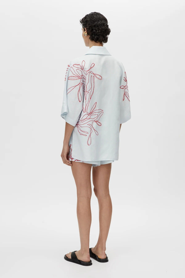 Eviva Shirt in Ice Blue by Camilla and Marc – a clshort-sleeve shirt with beaded embroidery and clean lines, perfect for bright polished days.