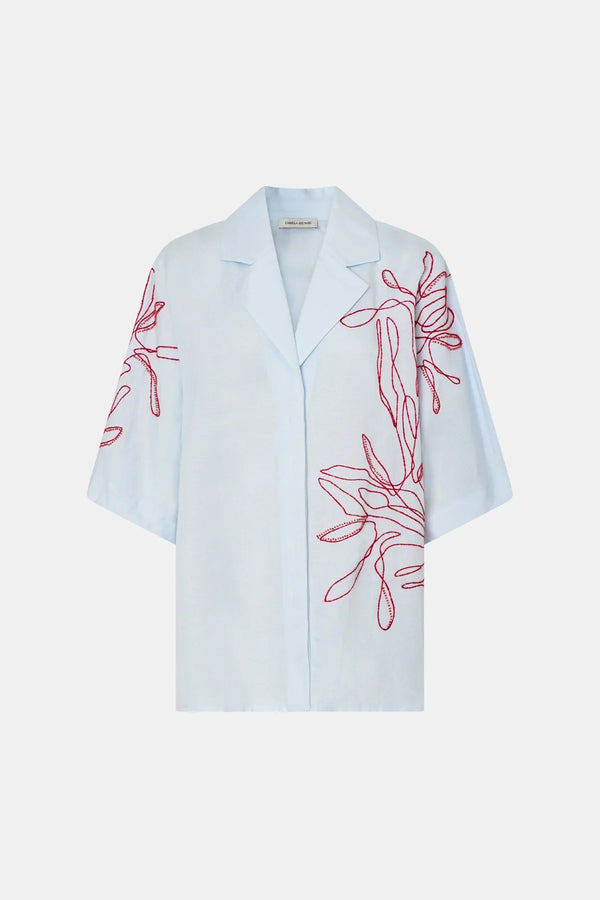 Eviva Shirt in Ice Blue by Camilla and Marc – a clshort-sleeve shirt with beaded embroidery and clean lines, perfect for bright polished days.
