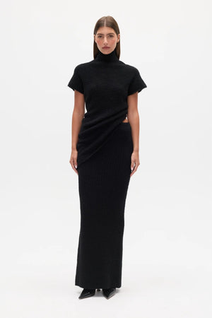 Evren Knit Top Black by Bayse – sculptural wool blend knit top with asymmetric wrap waist and high neckline.