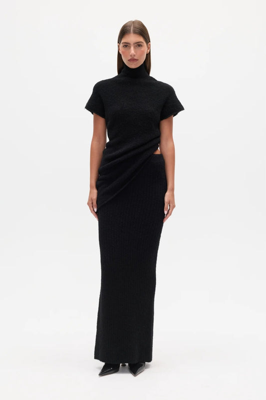 Evren Knit Top Black by Bayse – sculptural wool blend knit top with asymmetric wrap waist and high neckline.