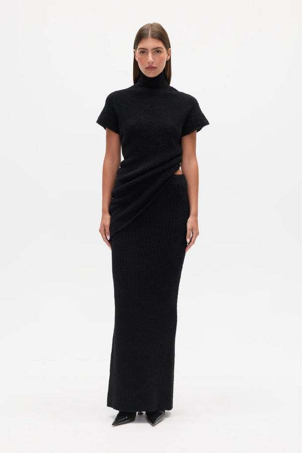 Evren Knit Top Black by Bayse – sculptural wool blend knit top with asymmetric wrap waist and high neckline.