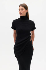 Evren Knit Top Black by Bayse – sculptural wool blend knit top with asymmetric wrap waist and high neckline.