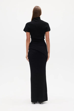 Evren Knit Top Black by Bayse – sculptural wool blend knit top with asymmetric wrap waist and high neckline.