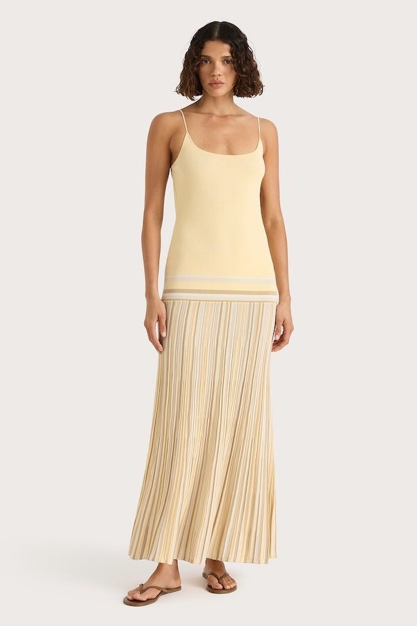 Citara Maxi Dress Butter Stripe by Faithfull the Brand – Trendy ribbed knit maxi with adjustable straps and backless tie, perfect for effortless summer elegance and beach days.