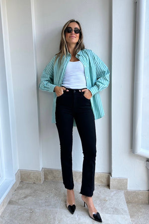 The Hustler Ankle Fray Jeans Not Guilty by MOTHER, vintage-inspired high-rise cropped bootcut in classic black denim, perfect for trendy casual looks.