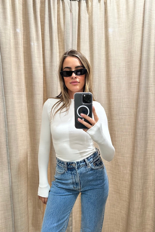 The Brooklyn Top White by Mossman, lightweight and super soft knitwear with thumb sleeve openings and a high round neckline, perfect for trendy layering days.