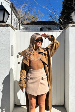 Sneaky Mini Skirt Latte by Sneaky Link – A-line high-waisted mini in bonded suiting with boned waist and mock pockets for chic all-day wear.