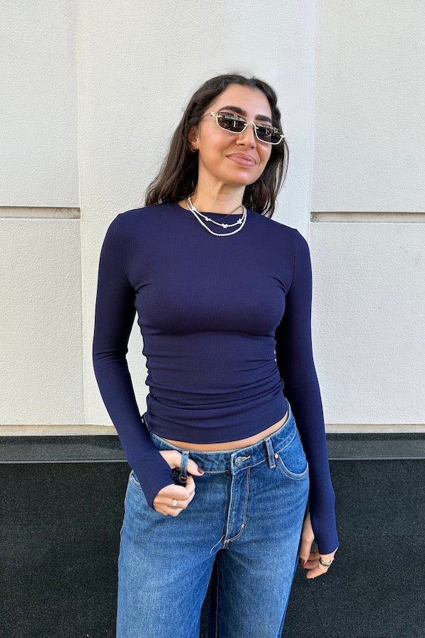 The Brooklyn Top Navy by Mossman, lightweight knitwear with a high round neckline and thumb sleeve openings, perfect for trendy layering and casual chic looks.