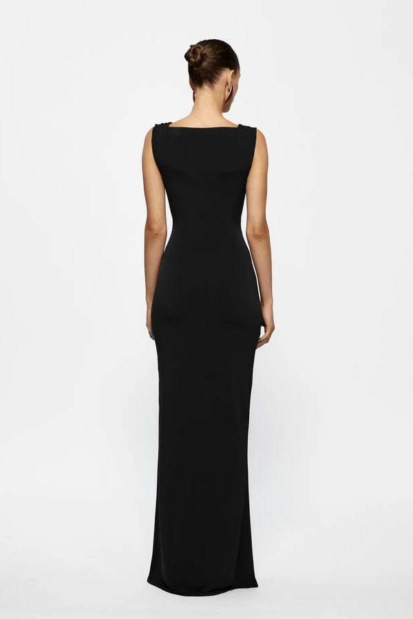 Faith Dress Black by Effie Kats, a reversible jersey gown with twist detail, cutout bodice, and soft train. Perfect for romantic events.
