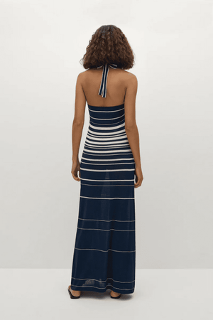 Axel Maxi Dress in Accordion Stripe Creamy Navy by Faithfull the Brand, chic halter-neck dress with a relaxed skirt and bust band detail, perfect for warm-weather events.