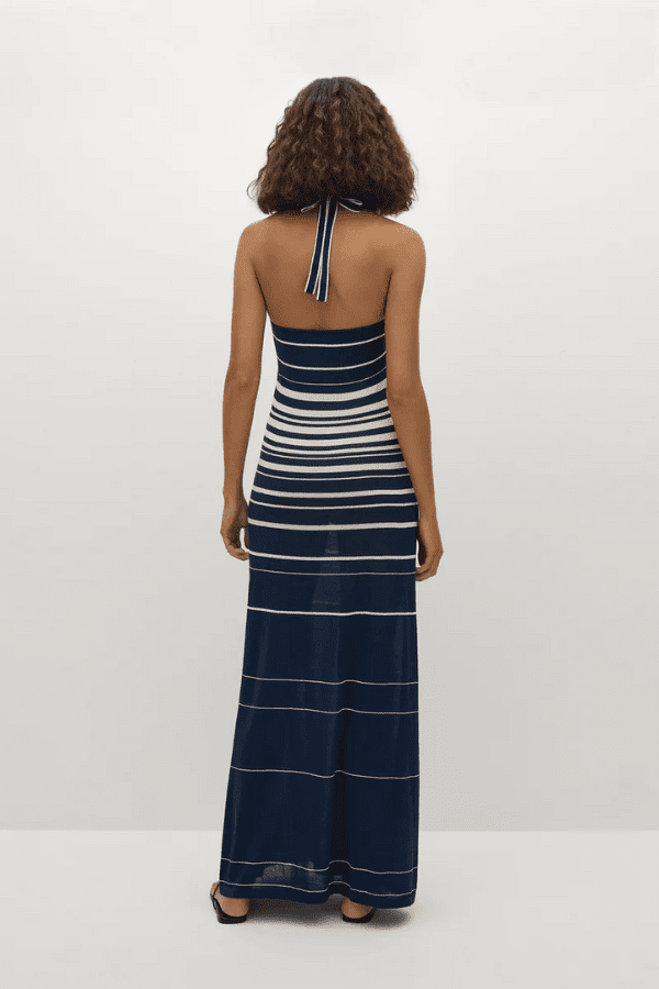 Axel Maxi Dress in Accordion Stripe Creamy Navy by Faithfull the Brand, chic halter-neck dress with a relaxed skirt and bust band detail, perfect for warm-weather events.