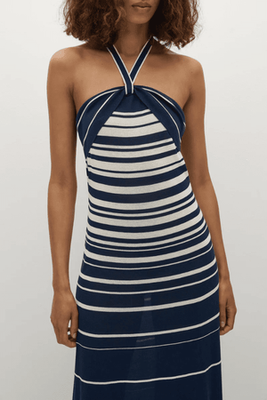 Axel Maxi Dress in Accordion Stripe Creamy Navy by Faithfull the Brand, chic halter-neck dress with a relaxed skirt and bust band detail, perfect for warm-weather events.