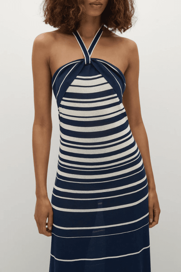 Axel Maxi Dress in Accordion Stripe Creamy Navy by Faithfull the Brand, chic halter-neck dress with a relaxed skirt and bust band detail, perfect for warm-weather events.
