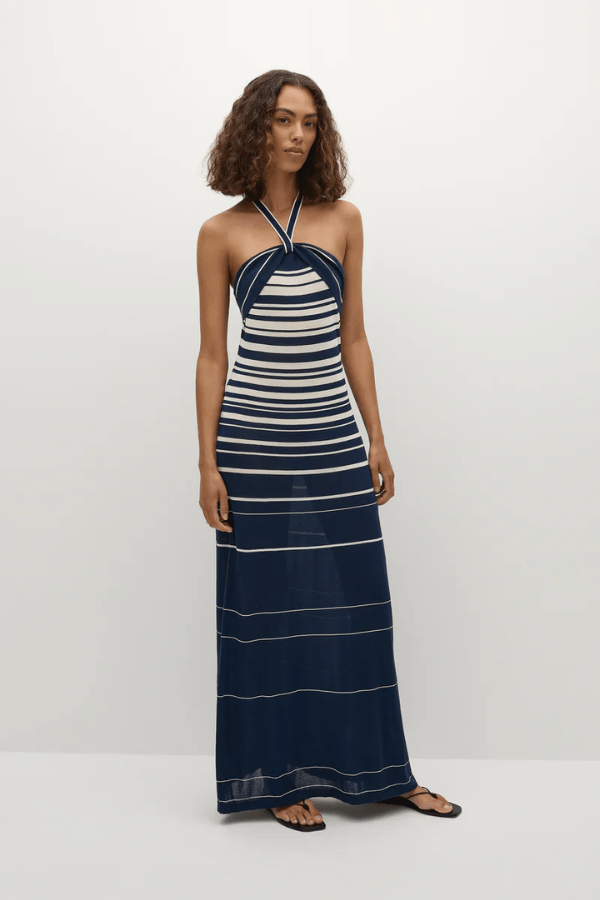 Axel Maxi Dress in Accordion Stripe Creamy Navy by Faithfull the Brand, chic halter-neck dress with a relaxed skirt and bust band detail, perfect for warm-weather events.