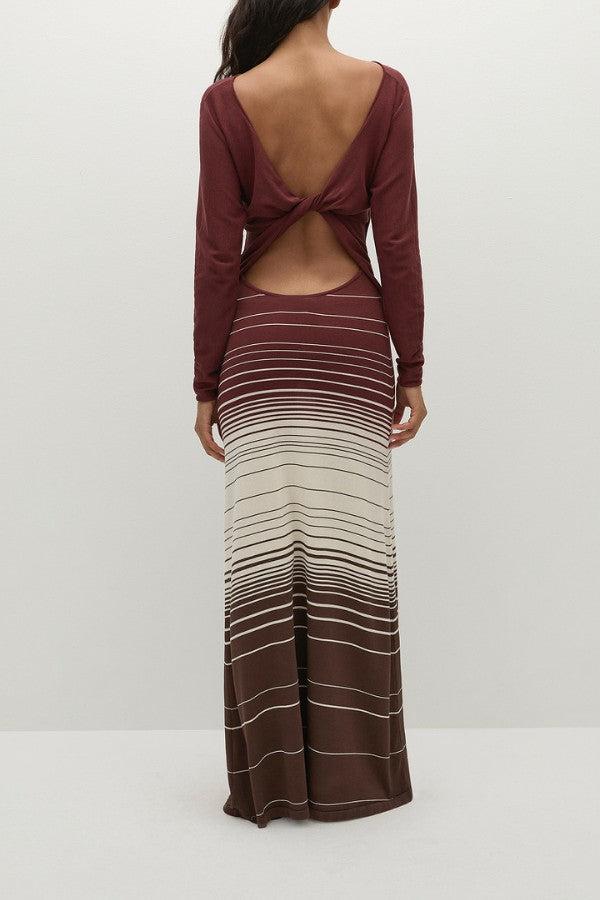 Faithfull the Brand Idun Maxi Dress in Accordion Stripe Bordeaux, knit maxi with boat neckline, twist back detail, and flared skirt.