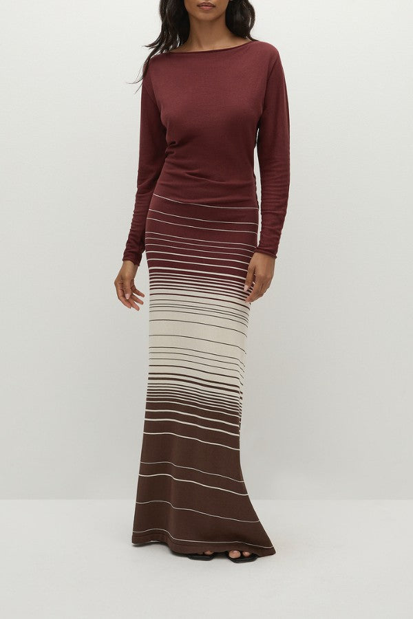 Faithfull the Brand Idun Maxi Dress in Accordion Stripe Bordeaux, knit maxi with boat neckline, twist back detail, and flared skirt.