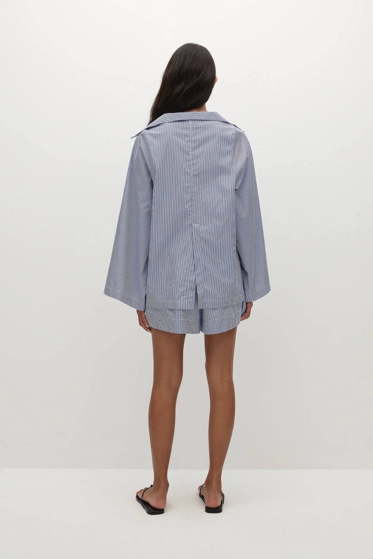 Faithfull the Brand Lonia Shorts in Helle Stripe Vintage Navy with relaxed boxer fit, mock fly, elastic waist and side pockets.
