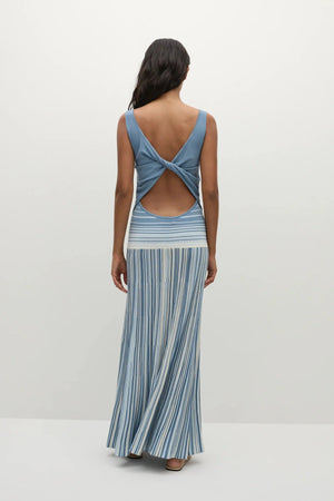 Faithfull the Brand Xyla Maxi Dress in Accordion Stripe Mineral Blue with boat neckline, twist knot back and flared A-line skirt.