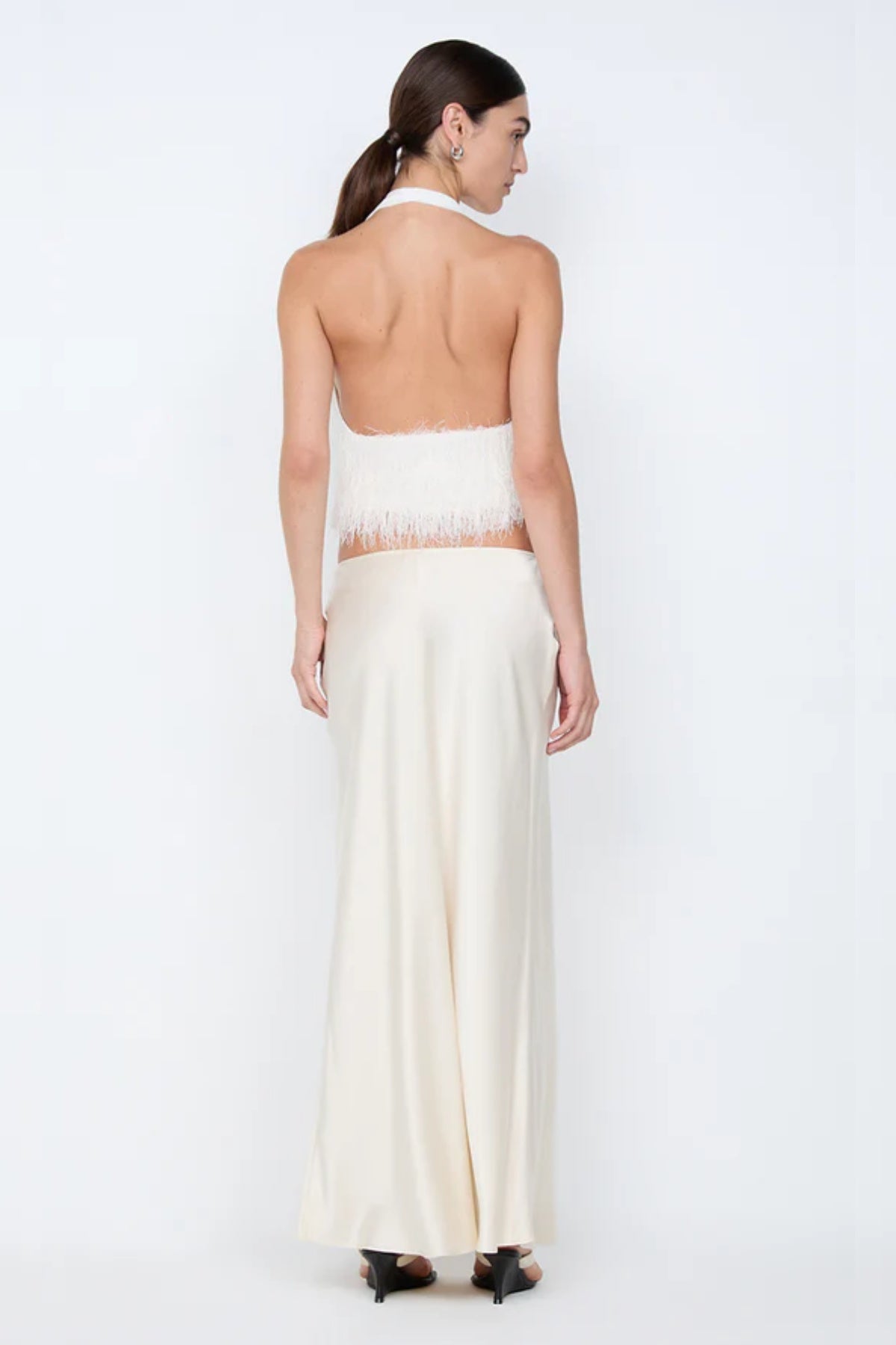 Finley Top by Bec + Bridge, a sleek halter silhouette with a statement fringe underbust detail—perfect for bridal celebrations or chic summer styling.