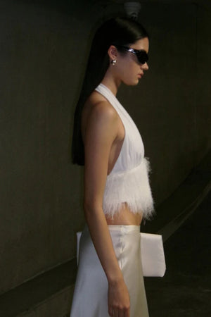 Finley Top by Bec + Bridge, a sleek halter silhouette with a statement fringe underbust detail—perfect for bridal celebrations or chic summer styling.